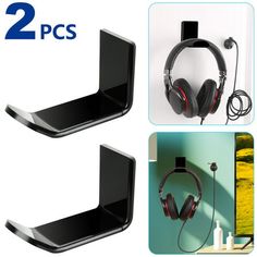 two black shelves with headphones hanging on them