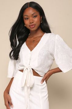 The Lulus Delightful Darling White Floral Embroidered Tie-Front Crop Top is just as sweet as you are! Crinkle-woven fabric, with floral embroidery throughout, shapes this top that has a V-neckline and fluttery short sleeves. The button-up bodice has a relaxed fit and ends at a cropped hem with a tie at the front. Fit: This garment fits true to size. Length: Size medium measures 16" from shoulder to hem. Bust: Great for any cup size. Waist: Loosely Fitted. Undergarments: May be worn with any stan Go Browns, Embroidered Tie, Casual Formal Dresses, Flirty Tops, Miles To Go, Lulu Fashion, Casual Wedding Dress, Fabric Accessories, Mamma Mia