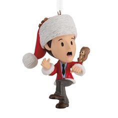 a christmas ornament with a man eating a donut