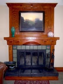 a fireplace with a painting on the mantle