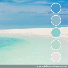 the beach is blue and white with circles on it's bottom half, in front of an ocean background