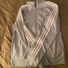 New With Tags. It’s A Soft Green Zip Up. Non Hooded. Three White Strips Down Arms. Adidas Sweatshirt Green, Dark Grey Adidas Hoodie, Adidas Casual Track Jacket For Spring, Adidas Jacket Aesthetic, Light Green Clothes, Adidas Clothes, Adidas Zip Up Hoodie, Adidas Jacket Women, Adidas Pullover