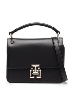 black calf leather logo plaque gold-tone logo lettering single flat top handle adjustable detachable shoulder strap foldover top main compartment Tommy Hilfiger Bag, Tommy Hilfiger Bags, Black Leather Bags, Leather Logo, Flats Top, Black Bag, Black Handbags, Top Handle, Calf Leather