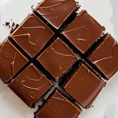 a close up of some chocolate squares on a table