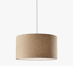 a light fixture with a beige shade on the bottom and a white cord hanging from the ceiling