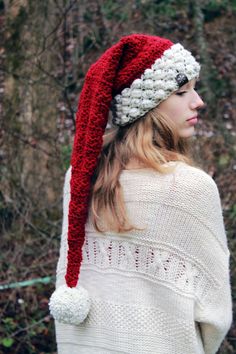 a woman wearing a red and white knitted hat