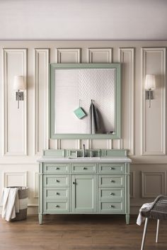 a bathroom vanity with a mirror and two lights on it's sides, in front of a white wall