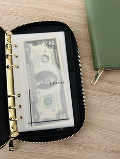 Stay organized and secure your essentials with this stylish A6 Zipper Wallet. This wallet showcases durable gold A6 rings, a convenient change pocket, card slots, and a pen loop, this wallet combines functionality with elegance. The vegan leather material adds a touch of luxury while being environmentally friendly. Details Gold A6/Personal Rings (15mm) 7 Card Slots 2 Side Pockets 1 Pen Loop 1 Zipper Pocket Fits all of my Cash Envelopes (Tabbed + Non-Tabbed) Cheap Green Wallets With Multiple Compartments, Cheap Purple Wallets For Everyday Use, Cheap Wallets With Bill Compartment For Daily Use, Cheap Handheld Wallets With Zipper Closure, Cheap Women's Wallets With Card Slots, Cheap Green Wallet For Everyday Use, Cheap Green Wallets For Travel, Affordable Wallets With Card Slots, Cheap Gray Wallets