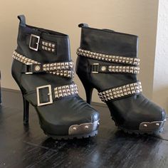 Hard To Find...These Are Beautifully Embellished Boots With Buckles...Rock ‘N’ Roll Style Feel. They Will Look Great With Jeans Or A Skirt For Your Night Out. Sold Originally For Over 500. Pour La Victoire, Jeannie, Women's Leather Ankle Boots, Studded, Black, Buckle Adjustment On The Ankle, Leather And Gunmetal Buckles And Studs, Around Toe With Metal And Studs In Front. High Heel Stiletto 4.5". Very Comfortable, Traction Platform Sole, Silver Metal Studs And Buckles. High Heel Moto Boots With Rivets For Party, Leather Party Heels With Rivets, Edgy Moto Boots With Metal Feet For Parties, Edgy High Heel Moto Boots With Metal Feet, High Heel Moto Boots With Studs For Parties, Party High Heel Moto Boots With Studs, Punk High Heel Moto Boots For Party, Party Moto Boots With Studs And High Heels, Edgy Heels With Rivets And Round Toe