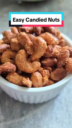 a bowl filled with nuts sitting on top of a table