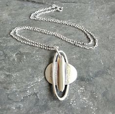 "A highly polished, solid sterling silver 3D Saturn pendant. The body of the plant is textured, and I've oxidised the silver to highlight the depth. Saturn's role in astrology is to bring meaning and structure to our lives. The pendant measures W 2.6 x H 4.6 cm and weighs a total of 13.8 grams with the necklace,  which is a sterling silver 18\" diamond cut belcher chain. The pendant is hallmarked at the Birmingham Assay Office. Supplied in a gift box." Saturn Pendant, Planet Pendant, Saturn Planet, Belcher Chain, Sterling Silver Chain, Diamond Cut, Sterling Silver Chains, Birmingham, Silver Chain