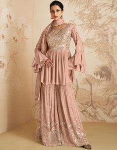 🍑 Embrace Peachy Charm! Explore our Peach Chinon Silk Palazzo Suit - a perfect blend of comfort and elegance. Ideal for capturing hearts with your graceful and stylish look. Get ready to radiate confidence and sophistication with your refined sense of fashion! ✨👗 #ArabicAttireFashion #PeachChinonSilk #EleganceInPeach #ChicSophistication #PalazzoPerfection Peach Dupatta, Anarkali Tops, Pista Green, Modest Evening Dress, Peach Shorts, Bridesmaid Saree, Party Sarees, Palazzo Suit, Sharara Suit