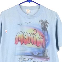 Description:Vintage Monica, Daytona Beach blue Sportswear t-shirt, fits large.GENDER: womens CONDITION: good - faint marks on front as shown.STYLE: t-shirtERA: 1990sCOLOUR: blueFABRIC: cotton blend 90s Style Blue T-shirt With Text Print, 90s Blue T-shirt With Text Print, Airbrush T Shirts, Black Light Posters, Beach Blue, Daytona Beach, Shirt Fits, Vintage 1970s, Flower Power