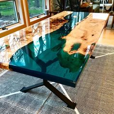 a table that is made out of wood and glass