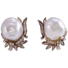 Vintage GIA certified baroque South Seas pearl clip earrings, circa 1935. These 14 karat yellow gold earrings feature two baroque South Sea pearls at approximately 14.50mm each, GIA cert #1176003511. They are accented with 38 single cut diamonds at .33 carat total weight. The diamonds have SI1 clarity and H color. These earrings are appraised at $7,038. [MICO 694] Dimensions 20mm H x 17.5mm W Formal Yellow Gold Baroque Earrings, Formal Baroque Yellow Gold Earrings, Classic Baroque Pearl Earrings For Formal Occasions, Classic Formal Baroque Pearl Earrings, Classic Baroque Earrings For Formal Occasions, Classic Baroque Earrings For Formal Events, Classic Yellow Gold Baroque Earrings, Classic Baroque Yellow Gold Earrings, Classic Baroque Pearl Earrings