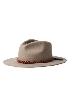 Pure wool felt elevates a Western-inspired fedora with timeless appeal. 100% wool Spot clean Imported Beige Wool Fedora With Curved Brim, Flat Bill Felt Hat For Fall, Spring Wool Felt Hat With Flat Brim, Fall Felt Hat With Flat Bill, Fall Flat Bill Felt Hat, Western Wool Fedora With Flat Bill, Western Wool Hat Band For Spring, Wool Fedora With Curved Brim For Winter, Western Wool Hat Bands For Spring