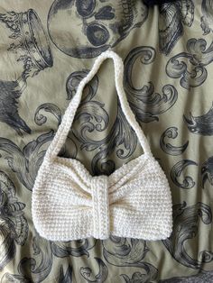 Super cute cream crochet shoulder bag! shaped like a bow and fastens at the back 🖤 White Rectangular Shoulder Bag With Bow, Cute White Bag With Bow, Elegant White Crochet Shoulder Bag, Chic Crochet Cream Shoulder Bag, Chic Cream Crochet Shoulder Bag, Crochet Shoulder Bag, Women Accessories Bags, Handmade Crochet, Women's Bag