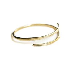 Brass or sterling silver bangle that wraps around wrist. Approximately 2 inches in diameter, can be adjusted by bending tighter or stretching wider. Stackable Open Ring Bracelets For Everyday, Everyday Yellow Gold Open Ring Bracelets, Everyday Yellow Gold Open Ring Bracelet, Hand Forged Open Ring Jewelry With A Modern Twist, Modern Twist Hand Forged Open Ring Jewelry, Elegant Hand Forged Bangle For Everyday Wear, Elegant Hand Forged Bangle For Everyday, Adjustable Minimalist Bangle Bracelet, Minimalist 14k Gold Open Ring Bracelets