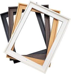 four different types of wood frames stacked on top of each other, with one white frame in the middle