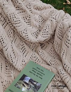 a book laying on top of a blanket