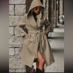 Classic Belted Pocket Hoodie Trench Coat Jacket S M L Xl, 100% Polyester, Ships In 7-8 Days Trendy Long Sleeve Outerwear With Adjustable Hood, Oversized Khaki Hooded Jacket For Fall, Fall Outerwear With Adjustable Hood, Cold Weather Fall Hoodie Outerwear, Fall Cold Weather Hoodie Outerwear, Trendy Fall Outerwear With Double-lined Hood, Fall Long Sleeve Hooded Jacket With Double-lined Hood, Adjustable Hood Outerwear For Fall Streetwear, Fall Outerwear With Adjustable Hood For Streetwear