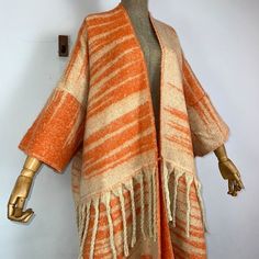 This super soft and warm wool cardigan kimono is perfect for the cold weather. Unlike other sweaters and wools, the wool used for this beauty is non itchy. Think of your favorite throw blanket, the comfort and warmth it gives but 10x stylish and wearable any where. This kimono is all that and more! One size fits S-4X Material: Wool One Size Fits Most Size Chart Cozy Acrylic Outerwear For Fall, Cozy Acrylic Sweater Coat For Fall, Bohemian Shawl For Fall Layering, Casual Beige Shawl For Winter, Cozy Long Cardigan For Fall, Cozy Wool Outerwear, Cozy Soft Knit Acrylic Outerwear, Beige Soft Knit Acrylic Outerwear, Warm Acrylic Cardigan For Fall