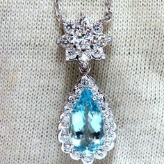 2.68ct Natural Aquamarine Diamonds Necklace Pear Shaped And Full Cut Vibrant Blue Aqua Color 13.3 X 7.4mm 1.05ct. Diamonds. Rounds Full Cut Brilliants Vs-2 Clarity G-Color. Overall Pendant: 31 X 12mm 17 Inches Necklace 14kt White Gold. Grand Weight: 5.5 Grams Appraisal Will Accompany For: $6,000 Luxury Pear-shaped Blue Topaz Jewelry, Luxury Blue Pear-shaped Necklace, Blue Pear-shaped Diamond Necklace, Pear-shaped Blue Brilliant Cut Jewelry, Diamonds Necklace, Aqua Color, Vibrant Blue, Natural Aquamarine, Pear Shaped