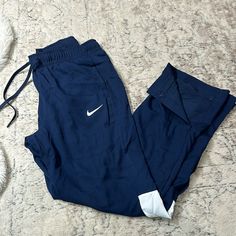 Nike Track Pants Never Worn Nike Navy Bottoms For Loungewear, Nike Navy Loungewear Bottoms, Nike Blue Loungewear Bottoms, Navy Nike Bottoms For Loungewear, Blue Nike Bottoms With Pockets, Sporty Blue Ankle-length Pants, Nike Track Pants, Nike Blue, Pants Color