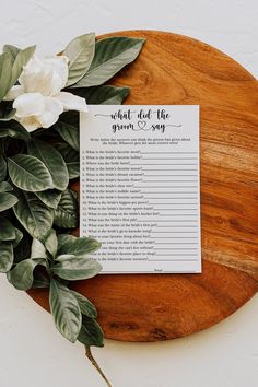 a wooden table topped with a plant and a sign that says what did the groom say?