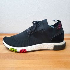 Step Up Your Sneaker Game With These Men's Adidas Nmd Racer Primeknit From The "Urban Racing Pack". The Stylish And Comfortable Sneakers Feature A Low Top Shoe Shaft Style, Standard Shoe Width, And A Cotton Blend Upper Material. The Shoes Are Black In Color With Atom Character, And Are Available In Uk Shoe Size 8.5, Us Shoe Size 9, And Eu Shoe Size 42 2/3. The Adidas Nmd Racer Primeknit Sneakers Were Released In 2018 And Are Perfect For The Athleisure Theme. Get Your Hands On A Pair Of These Sne Black Technical Sneakers With Boost Midsole, Dynamic Black Sneakers With Elastic Laces, Urban Black Running Shoes With Rubber Waffle Outsoles, Black Technical Sneakers For Light Sports, Technical Black Sneakers For Light Sports, Black Technical Running Shoes For Light Sports, Technical Black Running Shoes For Light Sports, Black Technical Running Shoes For Casual Sports, Adidas Black Running Shoes With Elastic Laces