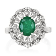 This stunning and timeless ring is meticulously crafted in solid 18k white gold, exuding both elegance and luxury. The centerpiece showcases a genuine oval-shaped emerald, weighing approximately 1.86 carats and prong-set to perfection, ensuring its vibrant green hue is the star of the show. Surrounding the emerald, you'll find 15 rose-cut diamonds and 14 round-cut diamonds, totaling approximately 1.30 carats with G-H color and VS clarity. These diamonds create a halo effect, amplifying the brilliance of the emerald and adding a sophisticated sparkle to the design. This elegant piece is in excellent condition, making it a perfect addition to any fine jewelry collection. Emerald Weight: Approx. 1.86 carats (genuine oval-shaped emerald) Diamond Weight: Approx. 1.30 carats (15 rose-cut diamond Luxury Oval Emerald Ring With Diamond Cut, Timeless Oval Diamond Cut Emerald Ring, Oval Emerald Ring With Diamond Cut In Platinum, Oval Diamond-cut Emerald Ring, Oval Diamond Cut Emerald Ring, Floral Halo, Timeless Ring, Jewelry Appraisal, Fine Jewelry Collection