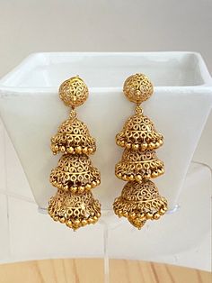 Highlights of the earrings ** Jhumka Earrings ** Gold-plated, Antique Finish Earrings  ** Classic Jhumki ** Free shipping over $35 This necklace will be shipped from Los Altos, California.  If you have any other questions, feel free to contact us.  JEWELLERY CARE Protect your Jewellery from Sharp Blows, Scratches, and Extreme Temperatures. Avoid Contact With Perfumes, Sprays, Chemicals, and Water. Keep your Jewellery in a Clean, Dry, and Airtight Box. Wipe it using a Soft Cloth Regularly. Thanks Bollywood Style Filigree Earrings For Festive Occasions, Bollywood Style Chandbali Filigree Earrings, Festive Filigree Jhumkas, Festive Filigree Danglers, Dangle Latkans Earrings For Puja, Latkan Dangle Earrings For Puja, Bollywood Style Danglers With Intricate Design For Puja, Traditional Filigree Jhumkas For Celebration, Bollywood Danglers With Intricate Design For Puja