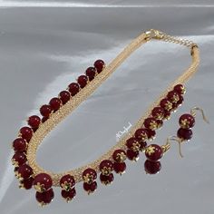 Beautiful Indian handcrafted gold plated mash chain necklace  filled with cz crystal stones and hanging Pearls with matching earrings.  The cz crystal stones filling gives the chain a dazzling sparkle. Package includes: 1 Necklace  + Earrings  A perfect gift for your loved once or yourself. It goes perfectly with any modern or traditional outfits and saree. Necklace Length: 41cm + 6cm adjustable chain Necklace Closer: Hook Earrings Length: 3cm Main Colour: Gold Pearl Colour: Maroon Pearl Wedding Jewelry Sets, Pearl Jewelry Set, Islamic Jewelry, Dangle Earrings Wedding, Wedding Jewelry Set, Pearl Jewelry Sets, Nose Jewelry, Jewellery Sets, Crystal Stones