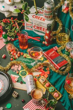 a table topped with lots of different types of food and drink items next to each other