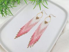 Peachy pinks and salmon colors with white ab and gold hand beaded fringe earrings stitched with Japanese made Miyuki Delica seed beads which are of the highest quality and consistency in shape and sizing.   The beads are handwoven to a gold teardrop base one bead at a time with a needle and nylon thread for strength. The total length of the earrings is 5in (13cm) including the Gold Plated surgical steel ear wires. *PLEASE NOTE* Products that I have created using natural stones and pearls...pleas Adjustable Pink Teardrop Beaded Earrings, Handmade Pink Teardrop Beaded Earrings, Boho Beaded Earrings, Hand Beaded Earrings, Loom Designs, Adornment Jewelry, Beaded Fringe Earrings, Earrings Teardrop, Bead Loom