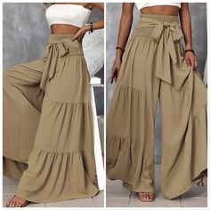 Shirred Waist Tie Front Ruffle Hem Wide Leg Pants Ships In 7-10 Days~All Purchases Are Shipped With A Special Gift 100% Polyester Slight Stretch Loose Fit Wide Leg Size Tags Are In Letters S-(4) M-(6) L-(8/10) Xl-(12) Do You Love? Anthro Festival Preppy Casual Mumu Revolve Spell Reformation Puff Popular Swim Contemporary Layering Free People Cami Dress Top Events Lulu Vacation Beach Contemporary Anniversary Boat Weekend Pool Swim Night Out~Then Visit My Store High-waist Beige Ruffled Bottoms, Bohemian Ruffled Bottoms In Solid Color, Beige Ruffled Bottoms For Fall, Ruffled Wide Leg Pants, High Waist Bohemian Pants, Khaki Wide Leg Pants For Summer, High Waist Ruffled Pants, Button Fly Pants, Beachy Dresses