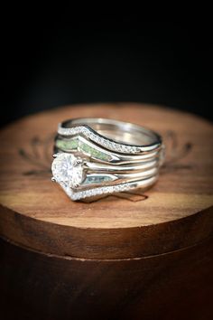 a close up of a ring on top of a wooden table