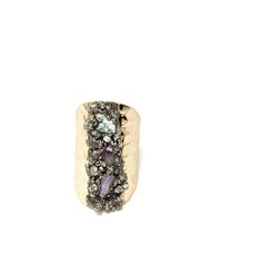 Big on looks the sparkling tri color raw gemstones are the focal point of this this adjustable boho gem statement ring DETAILS ✨ A richly textured piece, this 18k gold plated brass band is has adjustability from a US size 6+. The band is adorned with raw amethyst, turquoise and a milky white polished moonstone with metallic flecks of hand crushed raw pyrite creating a one of a kind piece. Mother nature rarely repeats herself so the pyrite center will vary slightly from the photos making each pie Bohemian Gold Multi-stone Rings, Gold Bohemian Multi-stone Rings, Bohemian Adjustable Crystal Ring With Gemstone Accents, Bohemian Rings With Raw Stone, Bohemian Multi-stone Adjustable Rings, Unique Crystal Open Ring With Gemstone Accents, Bohemian Adjustable Multi-stone Rings, Bohemian Gold Rings With Stones, Bohemian Crystal Ring With Stones