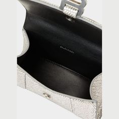 Balenciaga "Hourglass" top handle bag in strassed calf leather and suede with silvertone hardware Features hanging B logo on front  Rolled top handle  Detachable, adjustable crossbody strap, 21.6"L Flap top with magnetic closure  One interior compartment  Approx. 5.1"H x 7.4"W x 3.1"D Spot clean Made in Italy Luxury Silver Shoulder Bag With Detachable Handle, Luxury Top Handle Shoulder Bag With Silver-tone Hardware, Luxury Shoulder Bag With Silver-tone Hardware And Top Handle, High-end Silver Shoulder Bag With Palladium Hardware, Luxury Silver Shoulder Bag For Business, Designer Bag With Silver-tone Hardware And Round Handle, Luxury Shoulder Bag With Silver-tone Hardware And Round Handle, High-end Silver Top Handle Shoulder Bag, High-end Silver Bag With Silver-tone Hardware