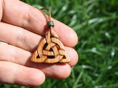 "This beautiful and unique hand-carved Triquetra Celtic necklace will be made for you, or a loved one, in my studio on the West of Ireland. This delicately carved Celtic knot pendant features a piece of Irish Elm wood. Considered one of the sacred trees in the Celtic world, elm has often been associated with Mother and Earth Goddesses. In rural Ireland the elm tree was said to possess magical properties and was considered to be the home of the fairies. Celtic knots date back to the 3rd to 4th ce Symbolic Carved Necklace For Gifts, Symbolic Carved Brown Jewelry, Adjustable Carved Nature-inspired Jewelry, Rural Ireland, Jewelry For Him, Elm Tree, Celtic Knot Pendant, Celtic Necklace, Pendant For Men