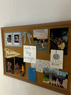 a bulletin board with pictures and magnets on it