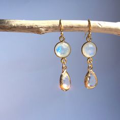 A Small Faceted Moonstone And A Crystal Clear Glass Droplet Hang Together. This Dainty Duo Is Subtle And Yet Still Catches Your Eye As The Mystic Moonstone Changes Color In The Light. 14k Over Sterling Silver Ear Wires And Gemstone Bezel, Gold Plated Bezel. Approx. Size: 1.5"L, 3/8"W Handmade Earrings By Jpeace Designs *Gemstones Are Natural And No Two Are Alike. Shape And Color Variations Are What Give Them Each Character. Magical Moonstone: Promotes Positive Well-Being And Balance. Moonstone Earrings Dangle, Preppy Hippie, Ethereal Jewelry, Faberge Jewelry, Moonstone Crystal, The Mystic, Moonstone Earrings, Moonstone Jewelry, Crystal Drop Earrings