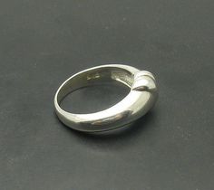 Sterling silver ring 925/1000. Stamped 925.Approximate weight 5.7 grams. Top width 1.0 cm (0.40 inches). All our jewels are made from solid sterling silver 925/1000 and are carefully crafted by hand in our family workshop. We dispatch your orders in 5 working days, worldwide and the postage is $5. We ship registered priority mail. Please allow 5-7 working days for delivery in Europe and 10-15 working days outside Europe. For any questions - please do not hesitate to contact me! Classic Sterling Silver Dome Promise Ring, Sterling Silver Formal Dome Ring With Round Band, Sterling Silver Dome Ring For Formal Occasions, Sterling Silver Domed Anniversary Ring, Classic Sterling Silver Dome Ring With Open Band, Sterling Silver Domed Ring For Anniversary, Silver Domed Rings For Anniversary, Elegant Concave Dome Ring In Sterling Silver, Sterling Silver Hallmarked Dome Ring