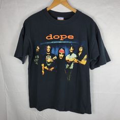 Dope Heavy Metal Vintage Band T Shirt Size Large L Black Punk Grunge Goth Tee. Dope Heavy Metal Band Shirt Is Pre-Owned With Wear. Size Large (Width 21", Length 28"), See Photos For Details. Make Sure To Follow Us! We Ship Every Day The Post Office Is Open! Black Band Logo Top For Alternative Fashion, Black Band Logo Tops For Alternative Fashion, Black Tops With Band Logo For Alternative Fashion, Black Punk Band Logo Tops, Black Punk Band Logo Top, Punk Black Top With Band Logo, Punk Style Black Top With Band Logo, 90s Style Black Deadstock Tops, Halloween Black Deadstock Tops