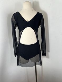 a mannequin wearing a black top with cut outs