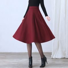 "★★ FEATURES * Wool skirt * Polyester lining * Two side seam pockets * Right zipper closure * pleated detail * Plus size full skirt * A Line Skirt * Perfect for Winter, autumn, spring * Dry clean ★★ The model is 170 cm (5′ 7″) tall with a 80 cm (31.5\") bust, 66 cm (26\") waist. She is wearing the red wool skirt in size XS. ★★ Bespoke Order Service If you Request other color Request the length Your height is not between 155 cm- 172 cm Your weight is over 75 kg I can do it for you, It will need s Retro A-line Winter Skirt, Winter Wool A-line Skirt, Red Long Skirt For Fall, Red Pleated Skirt For Fall, Red Full Skirt For Fall, Retro Winter Skirt, Winter Pleated Skirt In Solid Color, Red Flared Skirt For Fall, Burgundy Flared Skirt For Fall