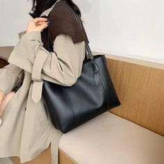 Place Of Origin : HE BEI  Province Types of bags : Shoulder Handbags Place Of Origin : HE BEI Province Occasion : Versatile Exterior : Open Pocket Interior : Interior Slot Pocket Hardness : SOFT Closure Type : No Zipper Pattern Type : Solid Gender : WOMEN Style : Casual Lining Material : None Handbags Type : Shoulder Bags Main Material : PU Shape : Casual Tote CN : Hubei Shoulder strap length: 54cm WHAT ABOUT REFUND?   Fast refund,100% Money Back Guarantee. If your product is defective or doesnt work properly, let us know and well send you a replacement one. We believe in our products so much that we offer a 30-day No-Hassle refund policy. If youre unhappy about your purchase, send us the product back and well refund your money immediately. Chic Solid Color Shoulder Bag For School, Chic Large Capacity Bags For School, Chic Large Capacity School Bag, Chic Solid Color Satchel For School, Trendy Faux Leather Bags For Everyday Use, Elegant Large Capacity Shoulder Bag For School, School Bag With Removable Pouch In Faux Leather, School Bags With Removable Pouch In Faux Leather, Classic Large Capacity Backpack Shoulder Bag