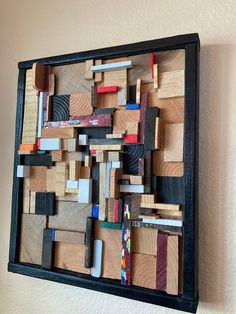 a wall hanging made out of wooden blocks