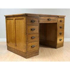 an old wooden desk with drawers on it