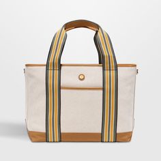 Hit the road, take to the skies or head to the beach with the handsome Cabana tote from Paravel. Crafted of creamy, textured canvas with a stain-repellant coating, the durable bag is accented with tan vegan leather details and straps striped jauntily in olive, mustard and white. Carry the tote to the office or pool, use as your personal item on flights or pack for overnight trips. The water-resistant blue satin lining finishes the medium bag with a secret touch of luxury.   • Durable, stain-repe Secret Touch, Shandy, Medium Bag, Textured Canvas, Stripes Texture, Hit The Road, Luggage Accessories, Blue Satin, Canvas Texture